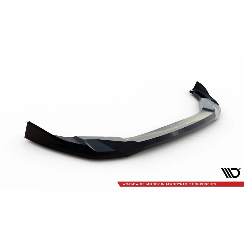 Front lip til BMW X3 M F97 Facelift V2 i svart og grå plast med markante former, sett skrått mot hvit bakgrunn.