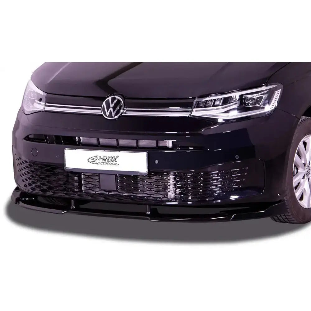 Frontspoiler Volkswagen Caddy SK/SKN 20- montert foran med blank svart finish og synlige luftinntak.