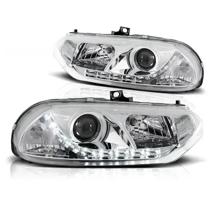 Frontlykter Alfa Romeo 156 10.97-06.03 chrome med LED-lys og kromdetaljer, sett fra skrå vinkel.