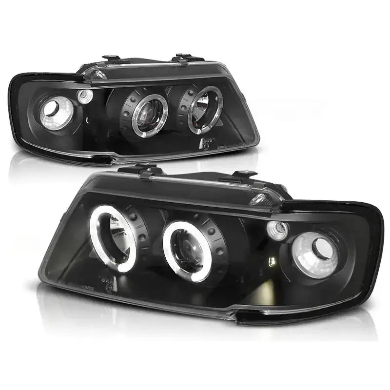 Frontlykter Audi A3 8L Angel Eyes Black med runde LED-lysringer, vist fra front mot hvit bakgrunn.
