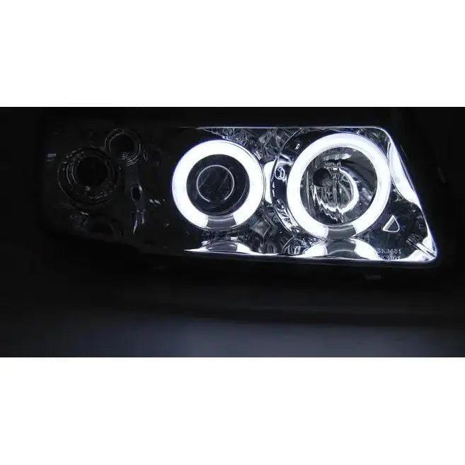 Hovedlys Audi A3 8L Angel Eyes CCFL Chrome med to LED-lysringer og reflekterende innside.