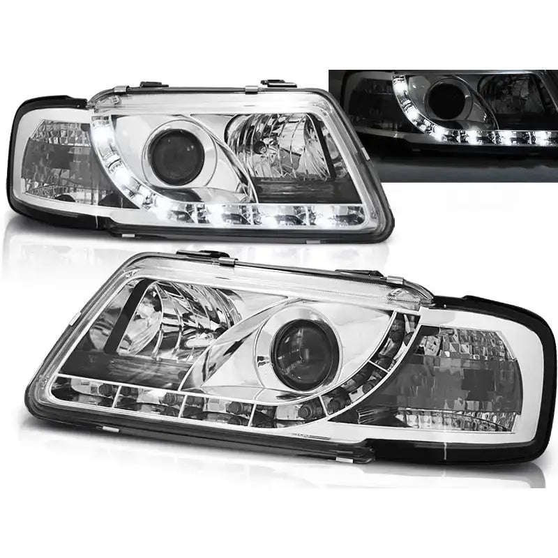Frontlykter Audi A3 8L Tru DRL Chrome vist forfra med LED-lys og sorte rammer.