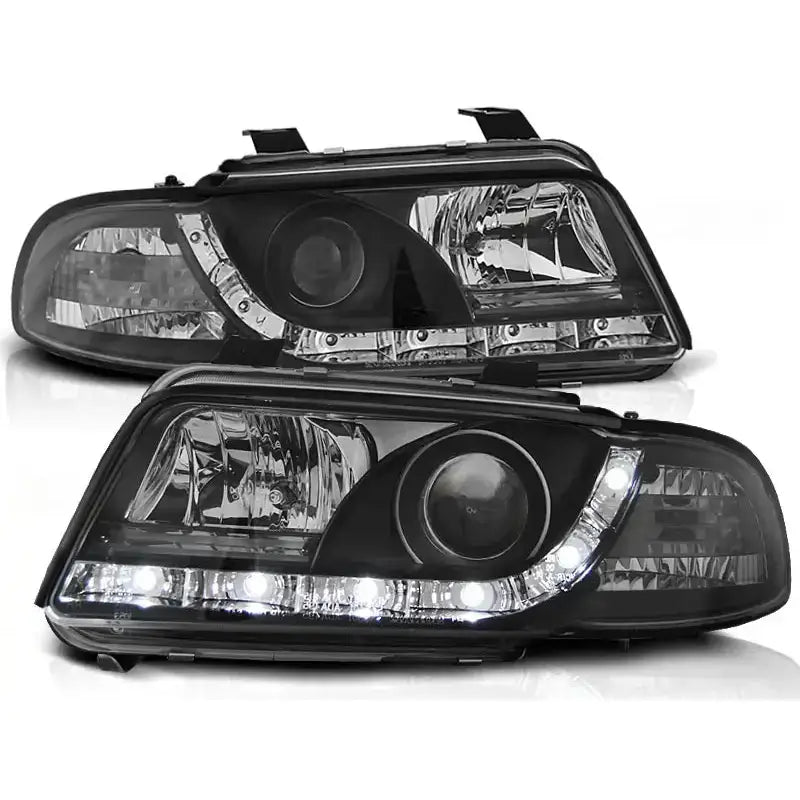 Frontlykter Audi A4 11.94-12.98 Black Led med klare linser og integrerte LED-lys, sett fra front og topp.