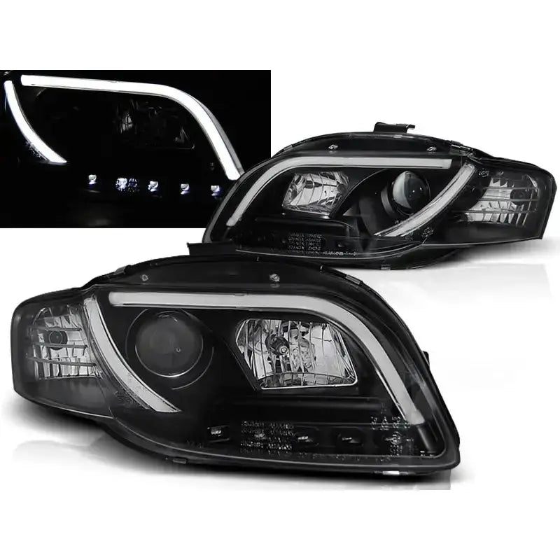 Frontlykter Audi A4 B7 LED Tube Lights i svart, vist fra skrå vinkel med lysene tent.