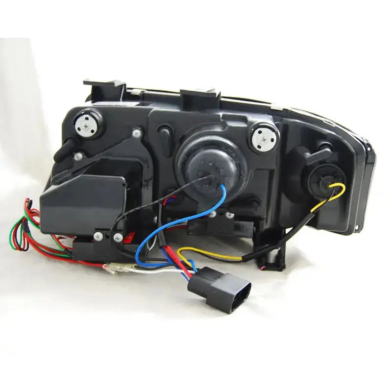 Hovedlys Audi A6 Tube Lights Tru DRL Black, svart bakside med ledninger og koblinger, skrå bakvinkel.