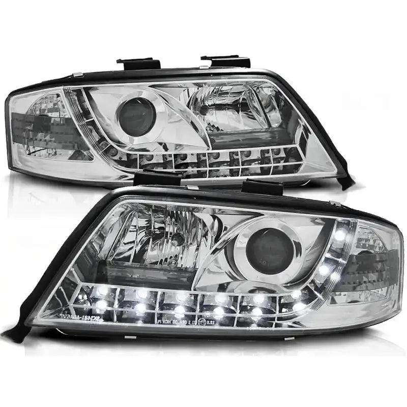 Frontlykter Audi A6 06.01-05.04 Chrome med klart glass, kromdetaljer og integrerte LED-lys.