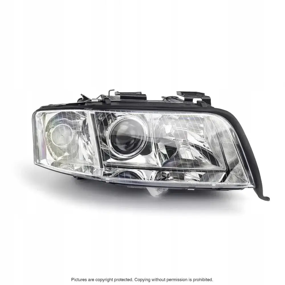 Frontlykter Audi A6 C5 01-04 H7/H7 sett forfra med klar plast og sorte rammer.
