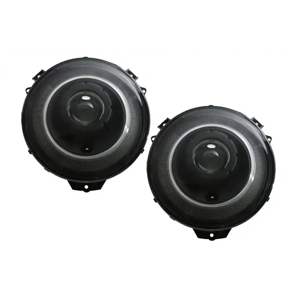 Frontlykter Bi-Xenon Mercedes G-Klasse W463 sorte runde lykter sett forfra mot hvit bakgrunn.