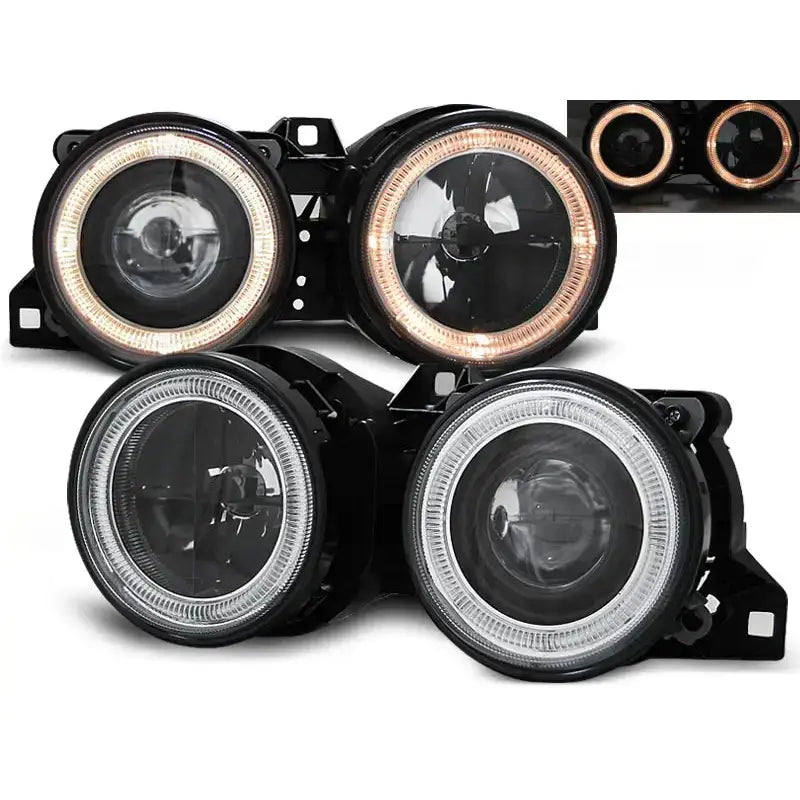 Frontlykter Bmw E30 Angel Eyes med sorte rammer og LED-lysring i hvitt og oransje.