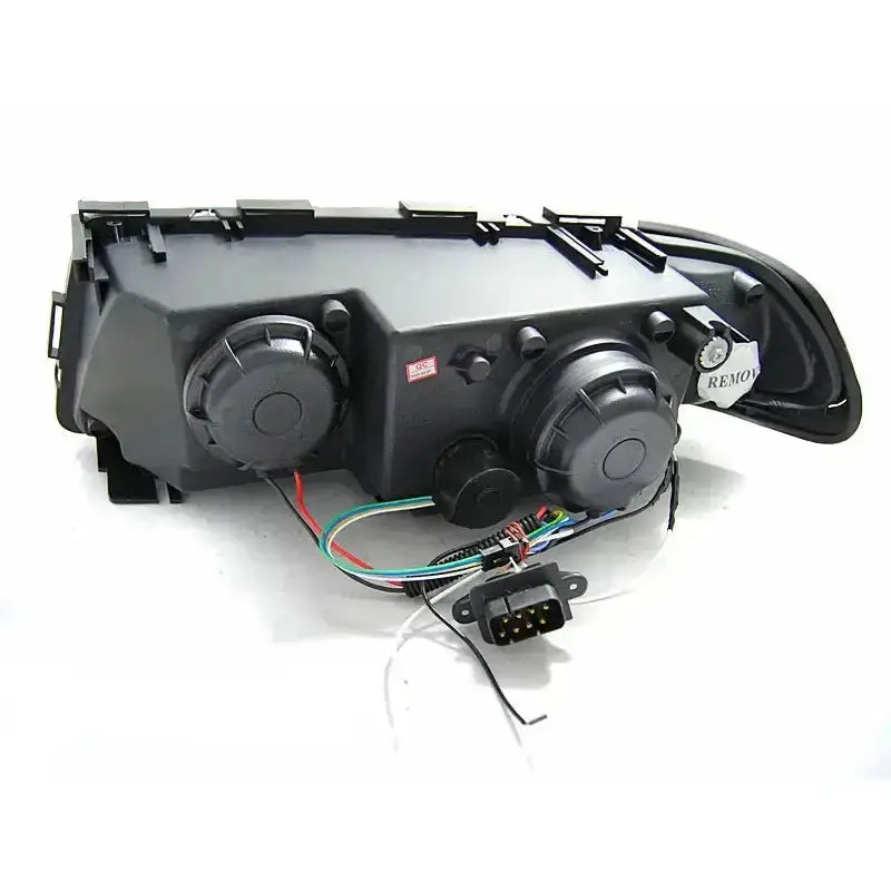 Headlights Bmw E38 94-01 bakside med ledninger, kontakt og runde innfestninger på svart plast.