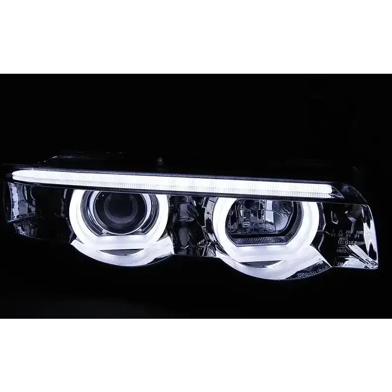 Hovedlykter Bmw E38 94-01 3D Angel Eyes LED chrome sett fra sidevinkel med sirkulære lys.
