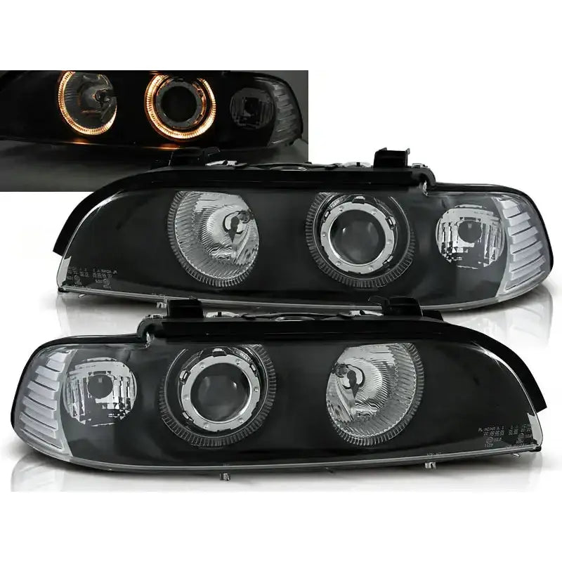 Frontlykter Bmw E39 Angel Eyes Black Halo Rims med klare glass og oransje LED-ring, sett forfra.