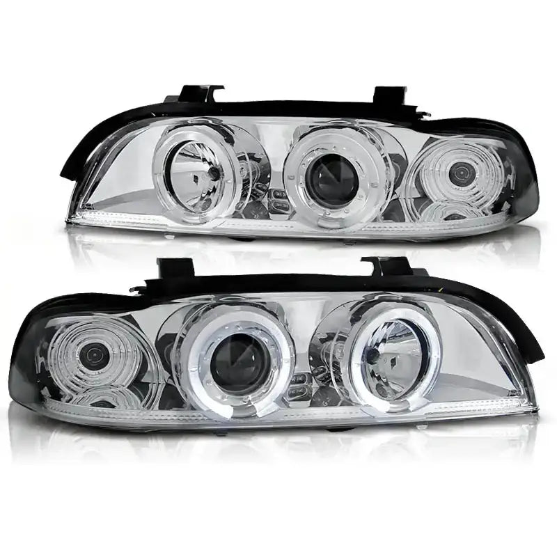 Hovedlykter Bmw E39 Angel Eyes Chrome med runde projektorlinser og sølvdetaljer, vist forfra.