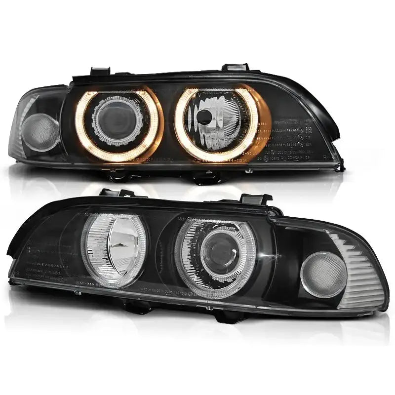 Hovedlykter Bmw E39 Angel Eyes D2S/H7 Black Xenon vist fra skrå forside med oransje LED-ringer.