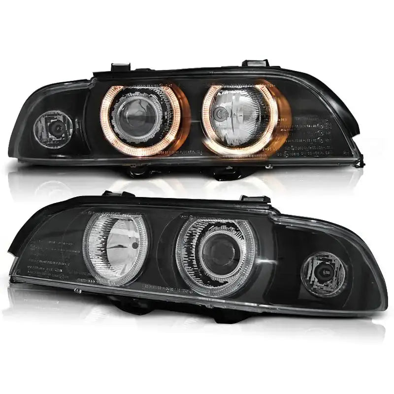 Hovedlykter Bmw E39 Angel Eyes sorte rektangulære lykter med oransje lysringer, sett forfra.