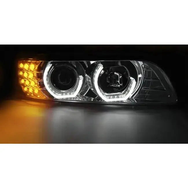 Headlamp Bmw E39 09.95-06.03 chrome med to LED-ringer og oransje blinklys, nærbilde mot svart bakgrunn.