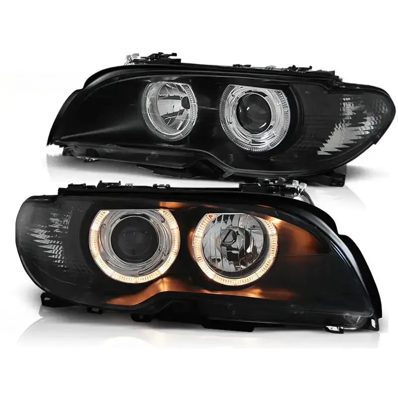 Frontlykter Bmw E46 Angel Eyes Black med klare linser og LED-ring, sett fra skrå forside.