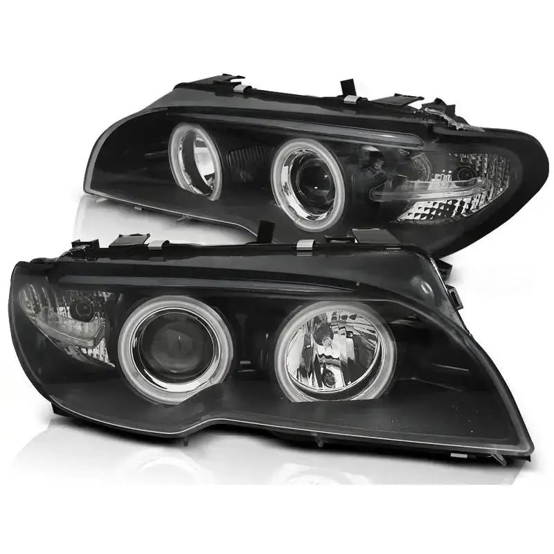Hovedlykter Bmw E46 Angel Eyes CCFL Black med klare glass og sorte innramminger, vist fra skrå vinkel.