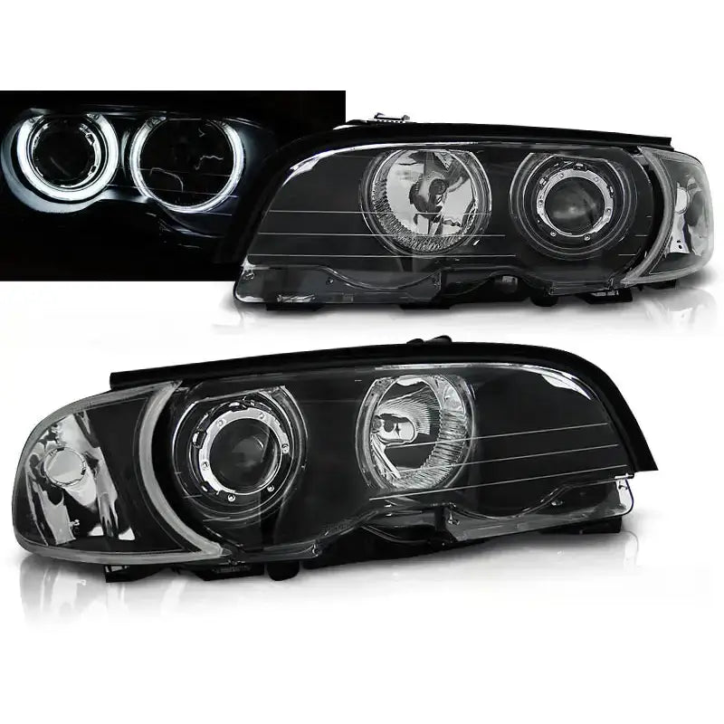 Frontlykter Bmw E46 Angel Eyes CCFL Black, sett skrått, med tent LED-ring i mørket.