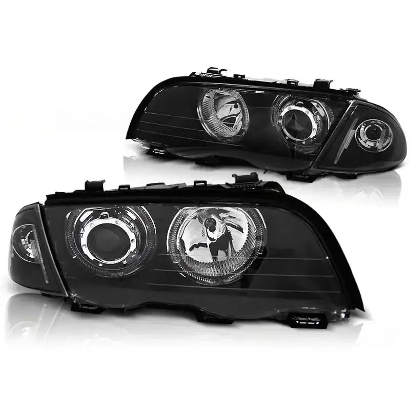 Hovedlykter Bmw E46 Angel Eyes LED i svart plast med runde reflektorer og kromdetaljer, skrå vinkel.