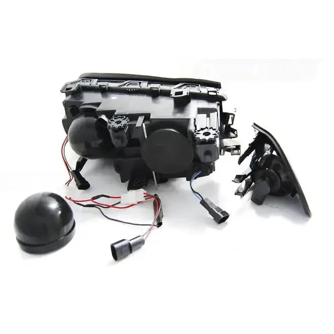 Headlights Bmw E46 Angel Eyes LED black sett bakfra med ledninger og koblinger mot hvit bakgrunn.