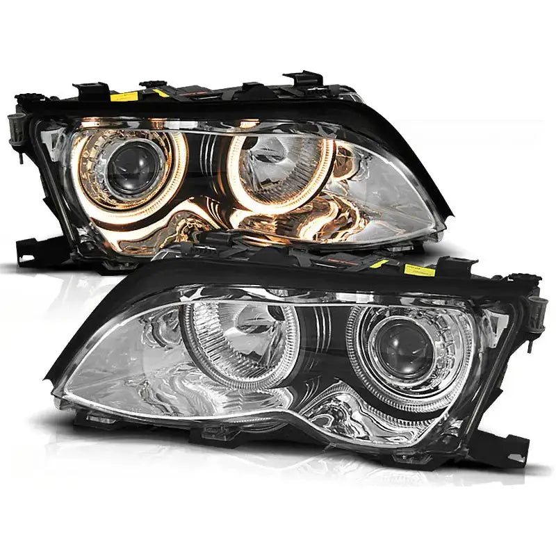 Frontlykter Bmw E46 Angel Eyes med chrome halo-ringer, én lyser LED, én avslått, sett fra skrå vinkel.