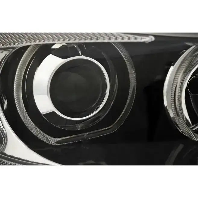 Hovedlys BMW E90/E91 LED Angel Eyes med sølv reflektor og ringstruktur i klart glass.