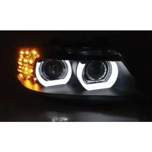 Headlights Bmw E90/E91 09-11 Xenon Led DRL Black AFS, nærbilde med hvite LED-ringer og oransje blinklys.