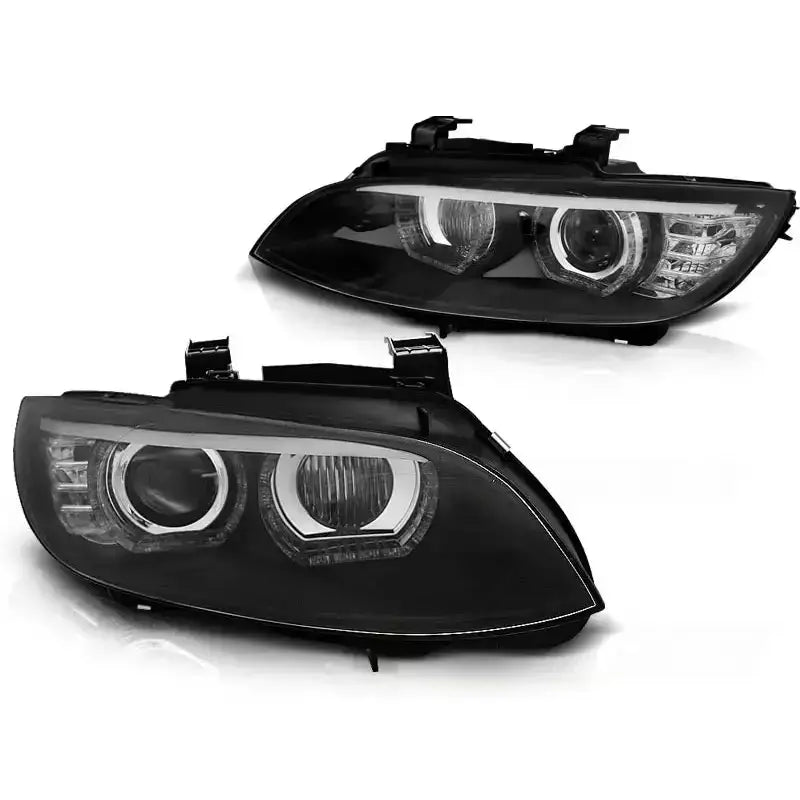 Hovedlykter Bmw E92/E93 Angel Eyes LED Black HID sett fra skrå vinkel med klare linser og sorte detaljer.