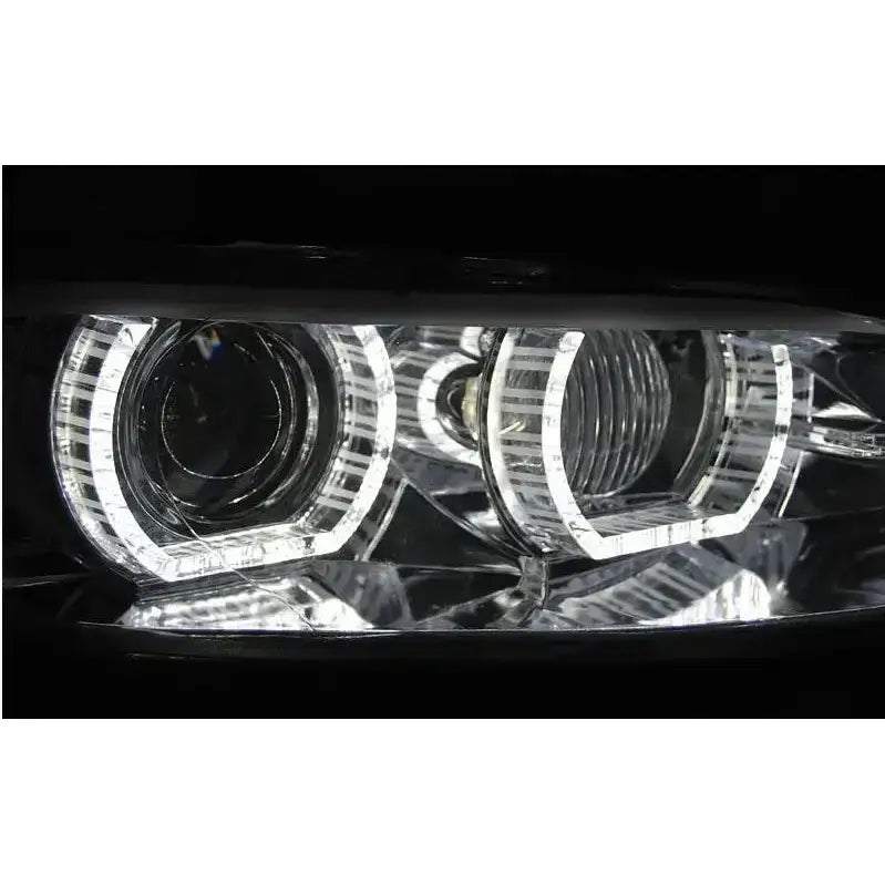 Hovedlys Bmw E92/E93 Angel Eyes LED Chrome HID, nærbilde av to runde billykter med LED-lysringer.