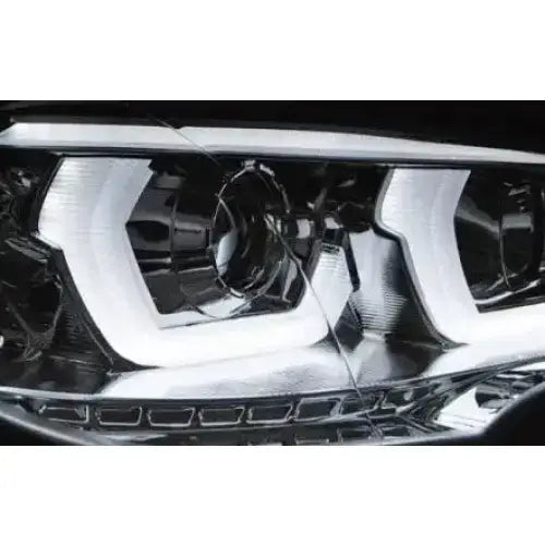 Hovedlykter Bmw X5 E70 07-13 med LED Tube Light DRL i krom, nærbilde av front og detaljer.