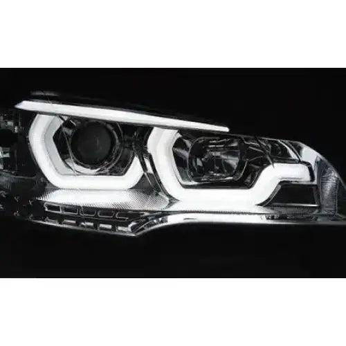 Hovedlys Bmw X5 E70 Tube Light DRL Chrome med hvite LED og detaljert reflektor mot svart bakgrunn.