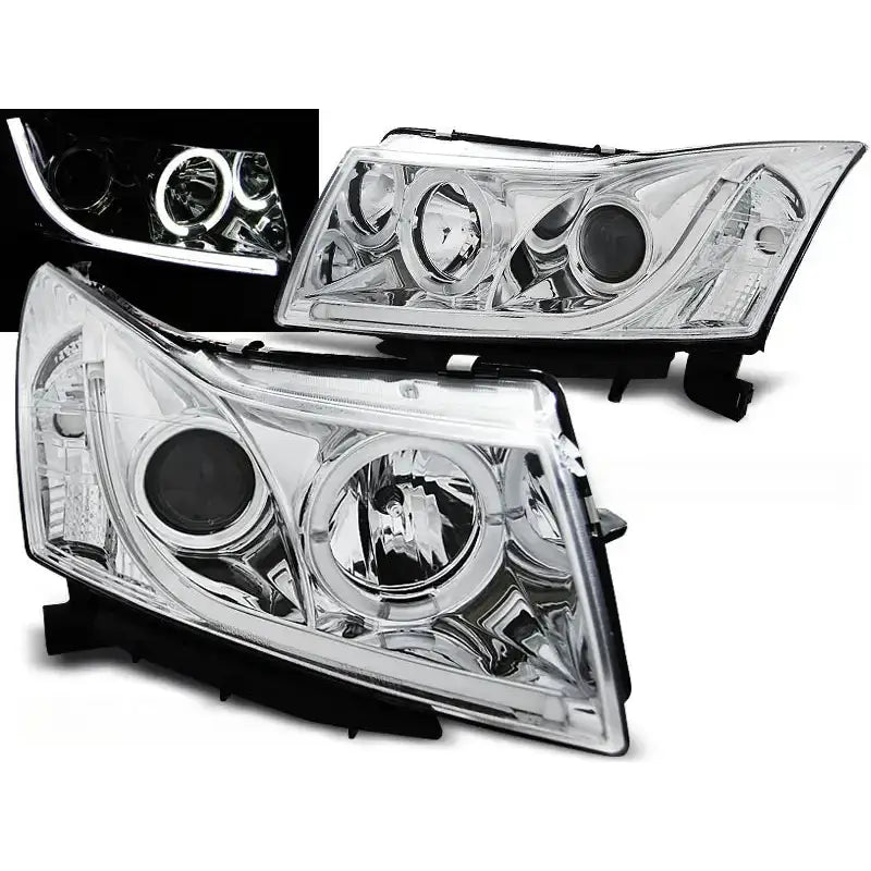 Frontlykter Chevrolet Cruze 09-12 Angel Eyes Tube Light Chrome med LED-lys tent, sett fra skrå vinkel.
