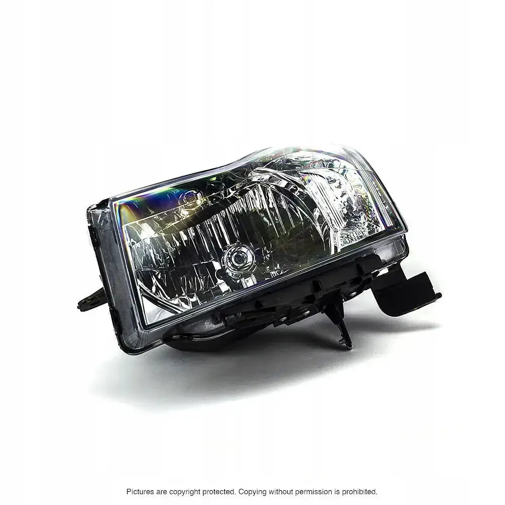 Headlights Chevrolet Cruze 09-12 H4 sett fra skrå vinkel med klart glass og sorte detaljer.