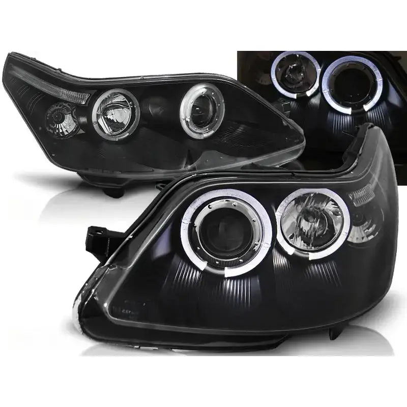 Frontlykter Citroen C4 04-10 Angel Eyes Black med sorte hus og LED-halo, vist fra skrå vinkel.