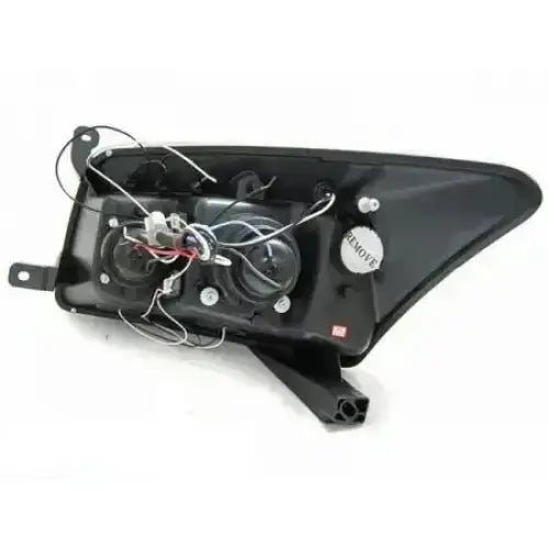 Headlights Dodge CALIBER Angel Eyes Black bakside med synlige ledninger og elektriske koblinger.