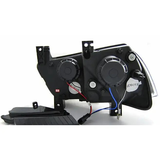 Hovedlys Dodge Charger LX II 11-15 bakside med ledninger, lokk og festepunkter på hvit bakgrunn.