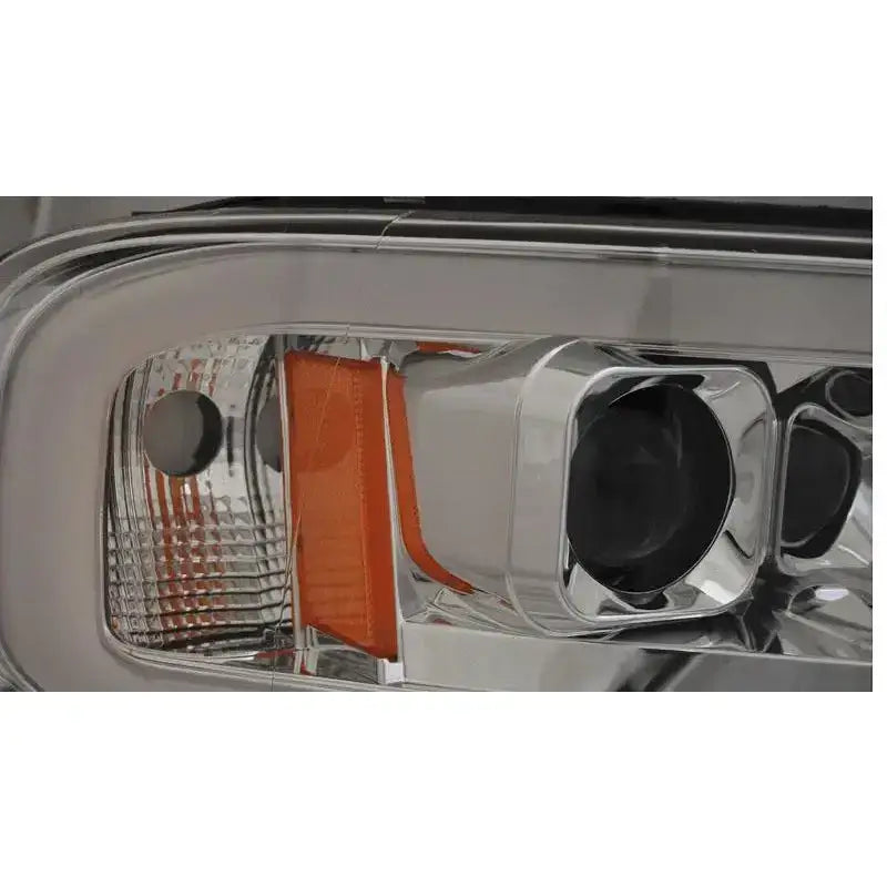 Hovedlys Dodge Ram 02-06 Tube Light Chrome med klart glass og sølv reflektor, oransje detalj.