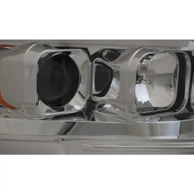 Headlights Dodge Ram 02-06 Tube Light Chrome med klart glass og kromdetaljer sett fra skrå vinkel.