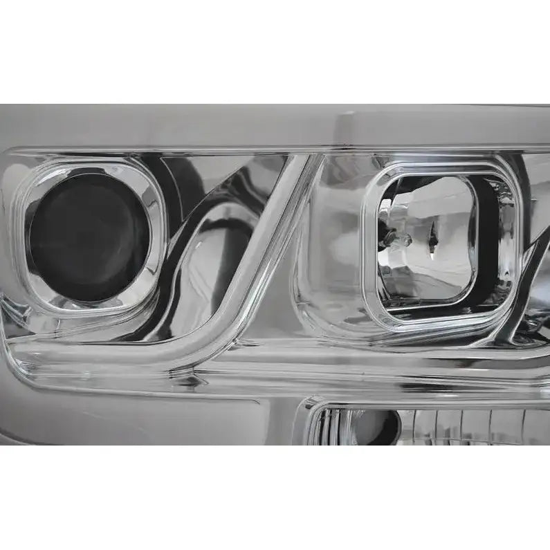 Hovedlys Dodge Ram 06-08 Tube Light Chrome nærbilde med synlige reflektorer og linsedetaljer.