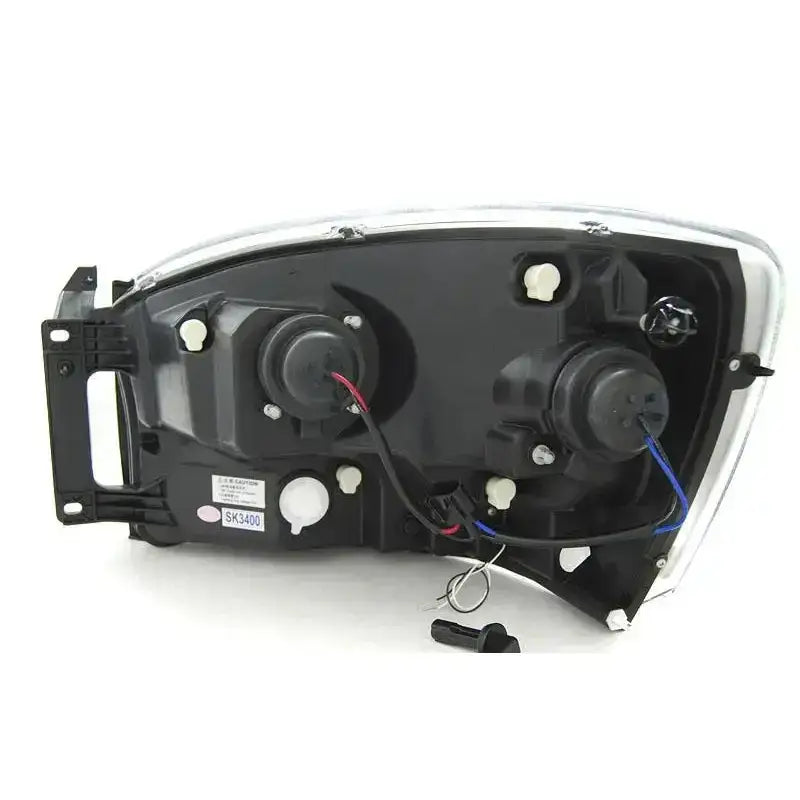 Frontlykter Dodge Ram 06-08 Tube Light Chrome sett bakfra med ledninger og festemekanismer.