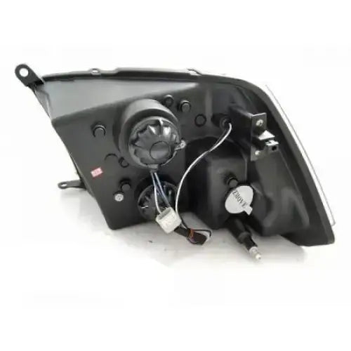 Headlights Dodge Ram 09-18 Tube Light Black sett bakfra med ledninger og lyspæreholder mot hvit bakgrunn.