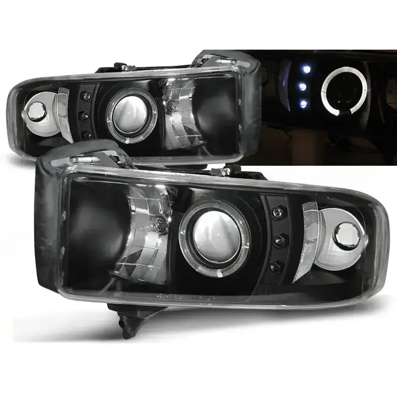 Frontlykter Dodge Ram 94-01 Angel Eyes Black med sotet glass og svarte detaljer, vist fra skrå vinkel.