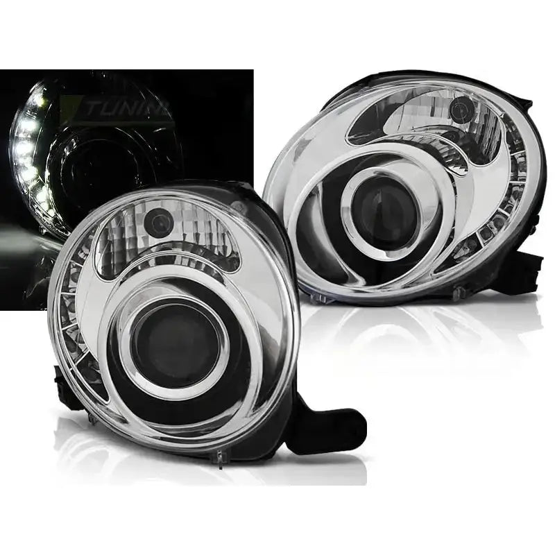 Frontlykter Fiat 500 07 Chrome LED, to runde billykter med sorte detaljer og LED-lys vist i mørket.