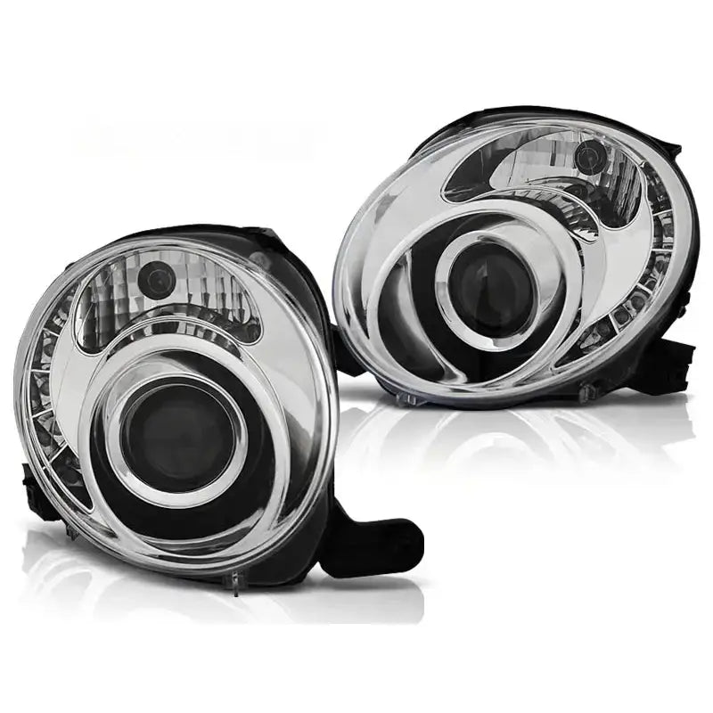 Hovedlykter Fiat 500 07- Chrome Led med klare glass og kromdetaljer, avbildet fra skrå vinkel.