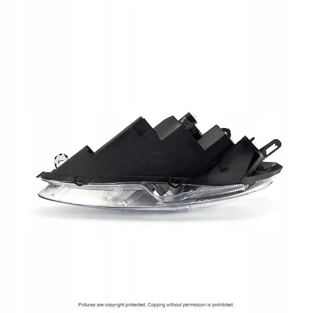 Hovedlykter Fiat Grande Punto 05-18 H4 sett fra siden med synlige festeanordninger og bakside.