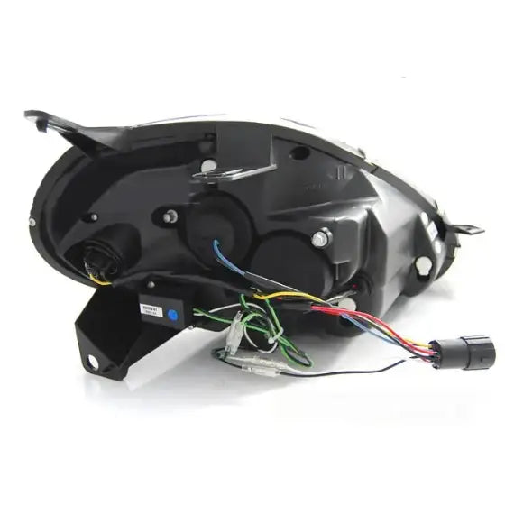 Hovedlykter Fiat Grande Punto 08-09 Chrome sett bakfra med ledninger, kontakter og festebraketter synlig.