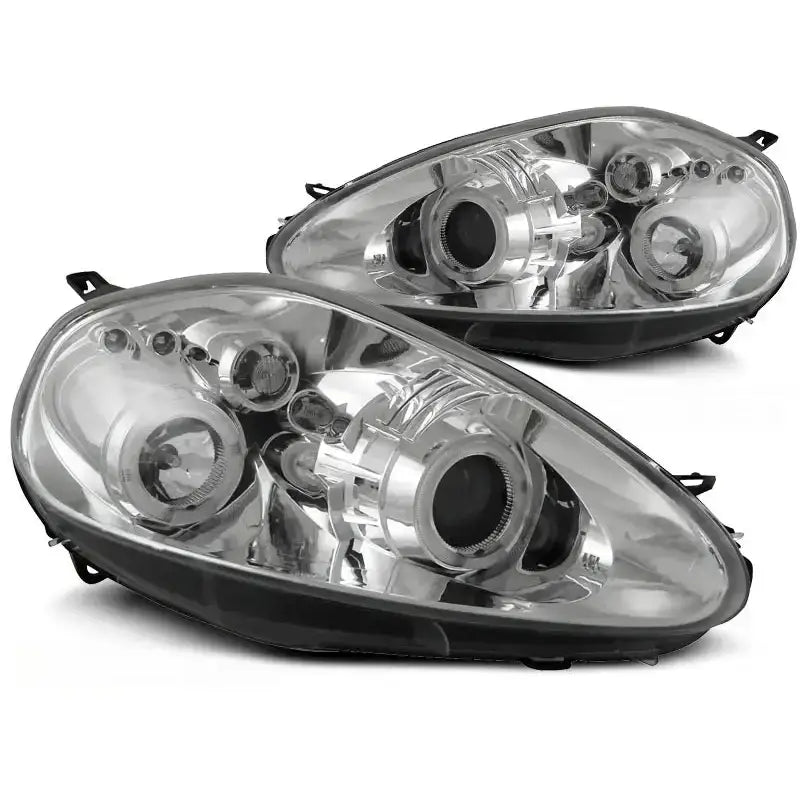 Hovedlykter Fiat Grande Punto Angel Eyes Chrome med klar linse og detaljer i svart og krom.