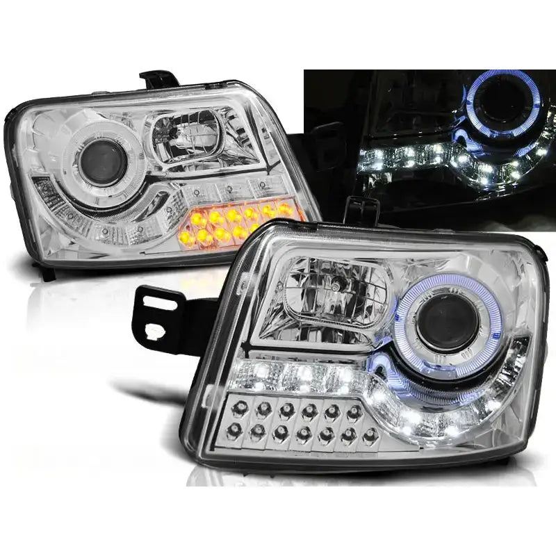 Frontlykter Fiat Panda 03-12 Daylight Chrome LED med klare linser og lysende oransje og hvite LED-detaljer.
