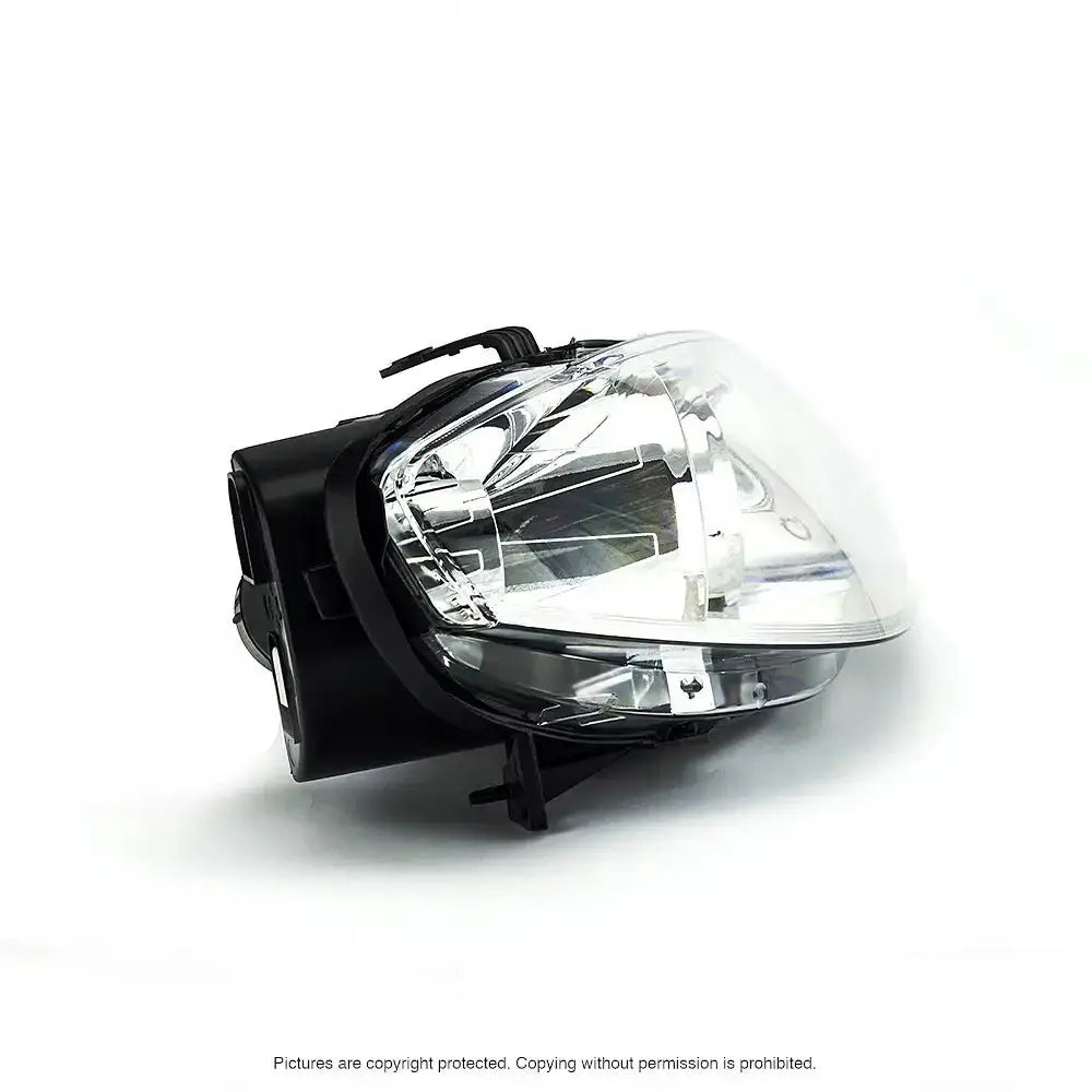 Headlights Fiat Punto 03-12 H1/H7 sett skrått fra siden med klart deksel og detaljert reflektor.